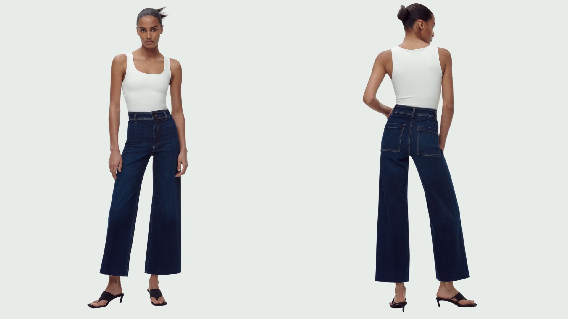 На фото модель в темно-синих джинсах Zara The High Rise Marine Straight Jeans.