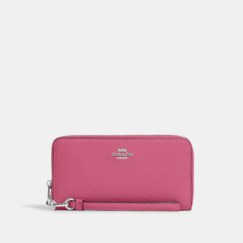 Кошелек Coach розового цвета.